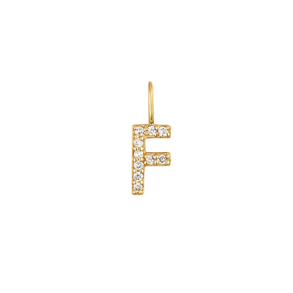 The Diamond Initial Charm, will add a touch of sparkle to your look. Each design is dainty, modern and playful. You’ll have so much fun personalizing, styling, stacking and showing off each piece.Material: 14K Solid GoldLetter Dimension: 6.2mm*3.5mmRing Diameter: 4mm*2.6mmStone Type: DiamondTotal Carat Weight: 0.05ct F | Diamond Initial Charm