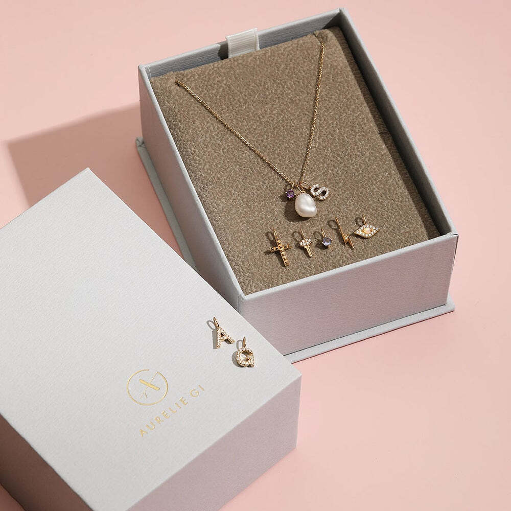 The Diamond Initial Charm, will add a touch of sparkle to your look. Each design is dainty, modern and playful. You’ll have so much fun personalizing, styling, stacking and showing off each piece.Material: 14K Solid GoldLetter Dimension: 6.5mm*5.3mmRing Diameter: 4mm*2.6mmStone Type: DiamondTotal Carat Weight: 0.076ct G | Diamond Initial Charm