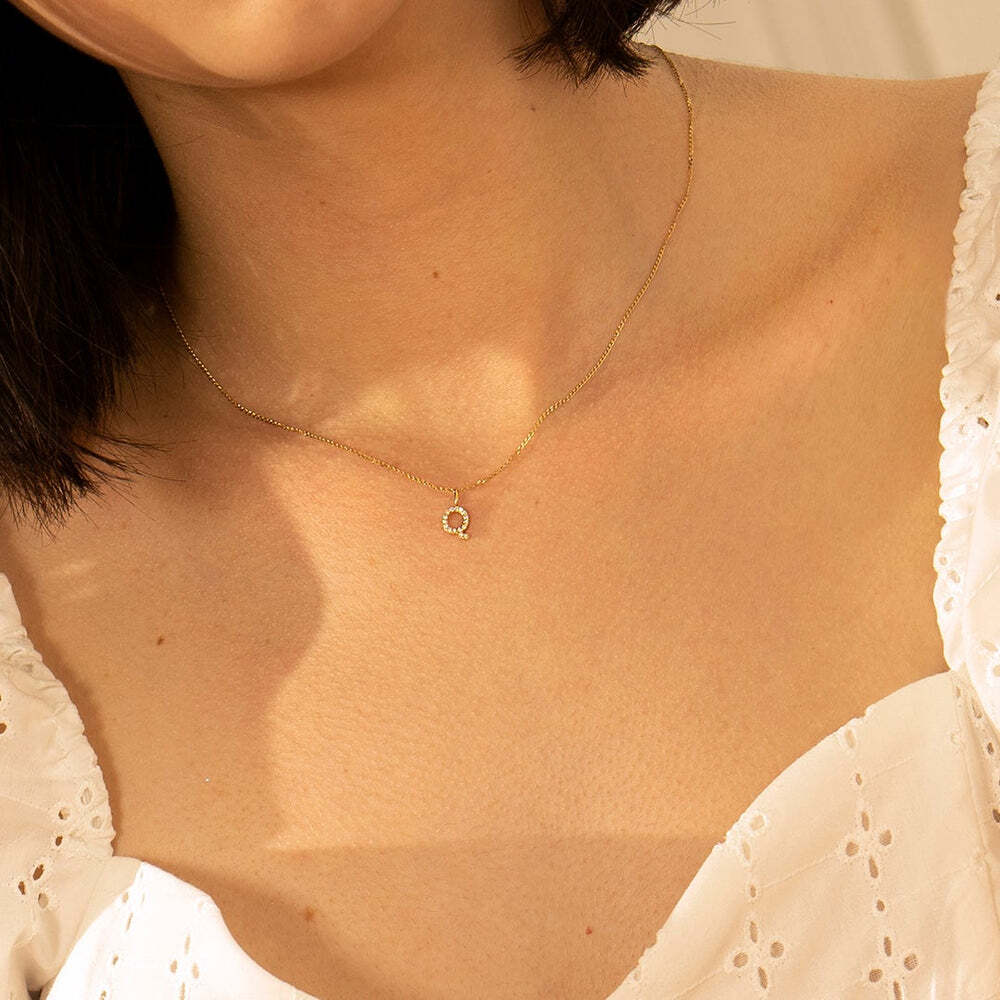 The Diamond Initial Charm, will add a touch of sparkle to your look. Each design is dainty, modern and playful. You’ll have so much fun personalizing, styling, stacking and showing off each piece.Material: 14K Solid GoldLetter Dimension: 7.5mm*5.6mmRing Diameter: 4mm*2.6mmStone Type: DiamondTotal Carat Weight: 0.08ct Q | Diamond Initial Charm