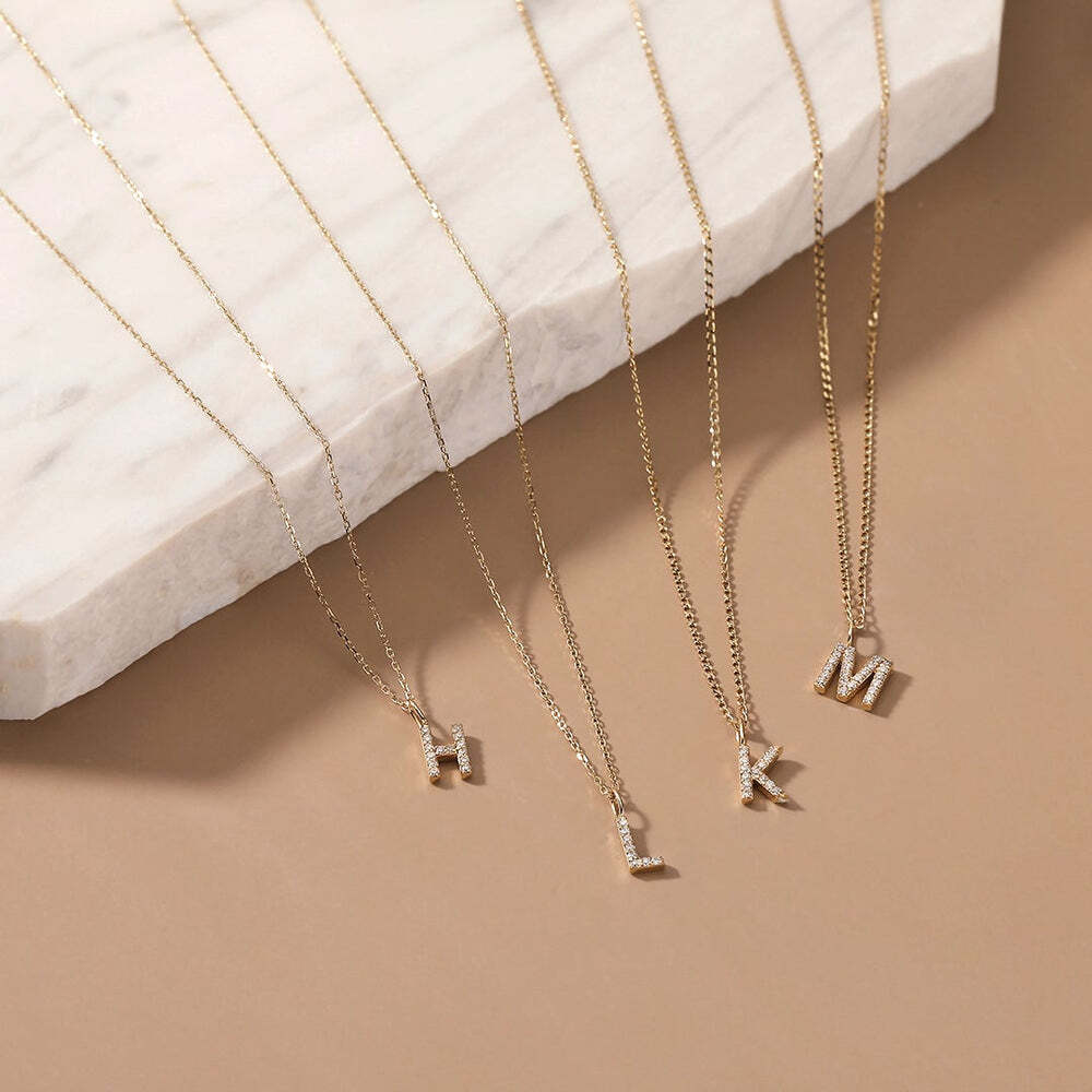The Diamond Initial Charm, will add a touch of sparkle to your look. Each design is dainty, modern and playful. You’ll have so much fun personalizing, styling, stacking and showing off each piece.Material: 14K Solid GoldLetter Dimension: 6.3mm*4.5mmRing Diameter: 4mm*2.6mmStone Type: DiamondTotal Carat Weight: 0.065ct K | Diamond Initial Charm