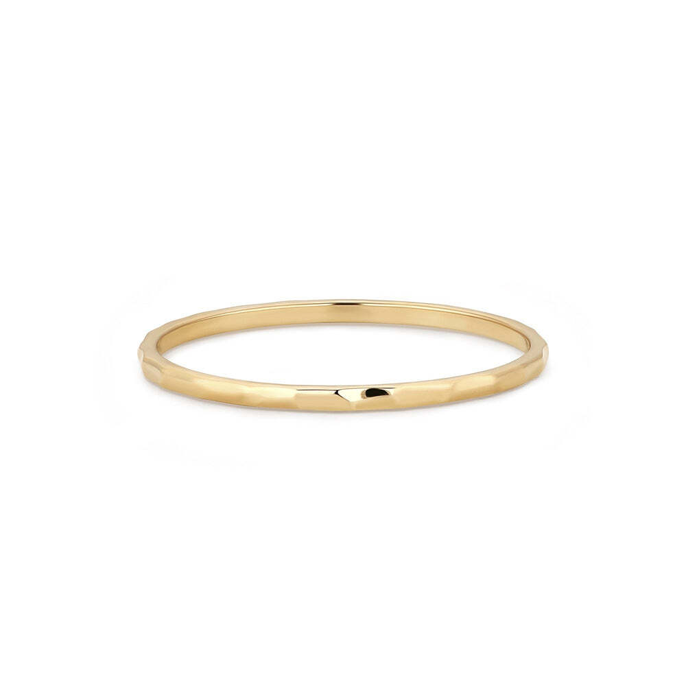 Update your look with our Textured Band, as always in rich 14k gold. Add this organic design alongside your classic bands for a fun mix of finishes.Material: 14K Solid GoldSize: #5,#6,#7,#8Band Thickness: 0.9mm REGALIA | Textured Band