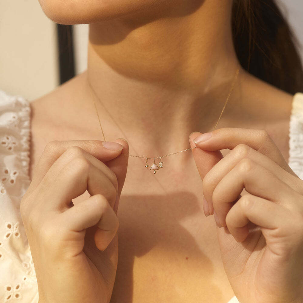 Mushroom charm…. Because who doesn't need a mushroom charm in their life? Show your personality and individuality with this fun dangle!Product Details:Material: 14K Solid GoldLength: 6.8mmWidth: 2.8mmRing Diameter: 4*2.6mmPowder Opal Size: 3.5*5.5mmTotal Carat Weight: 0.05gStone Type: Powder Opal TRUFFLE | Powder Opal Mushroom Charm