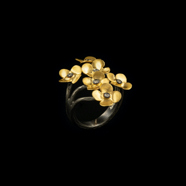 Closeup photo of DI .06 Six Flower Adj Gold Ring