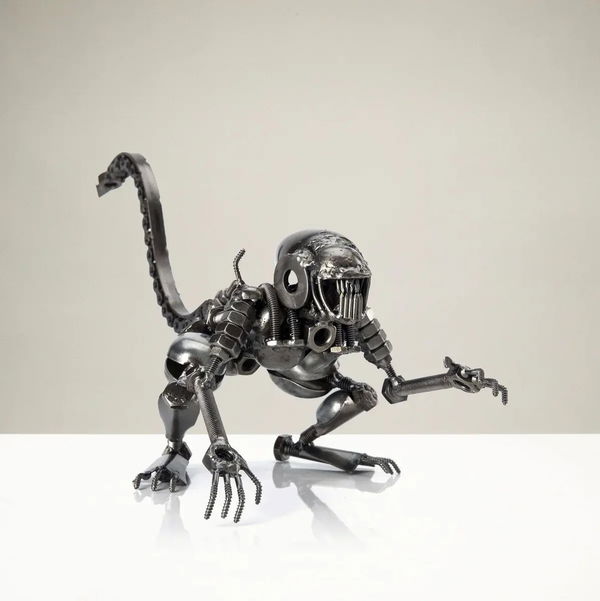 Closeup photo of Alien Crouched Inspired Recycled Metal Sculpture