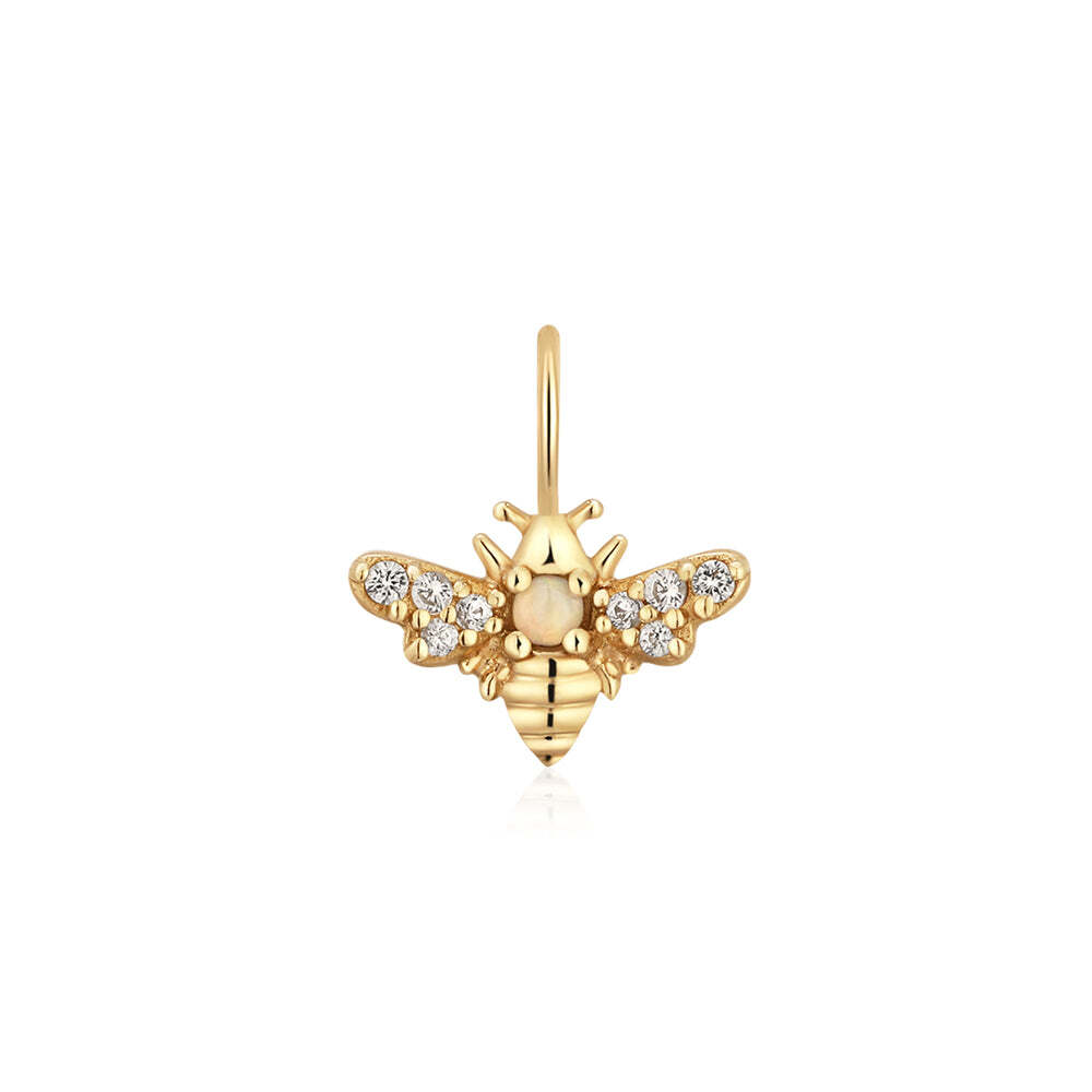 White sapphire and opal accents transform this little bee charm from ordinary to bzzzz-illiant!Product Details:Material: 14K Solid GoldLength: 8.4mmWidth: 8.1mmRing Diameter: 4*2.6mmSapphire Size: 0.8mmSapphire Size: 0.9mmOpal Size: 1.5mmTotal Carat Weight: 0.008gStone Type: Sapphire / Opal HONEY | Bee Charm