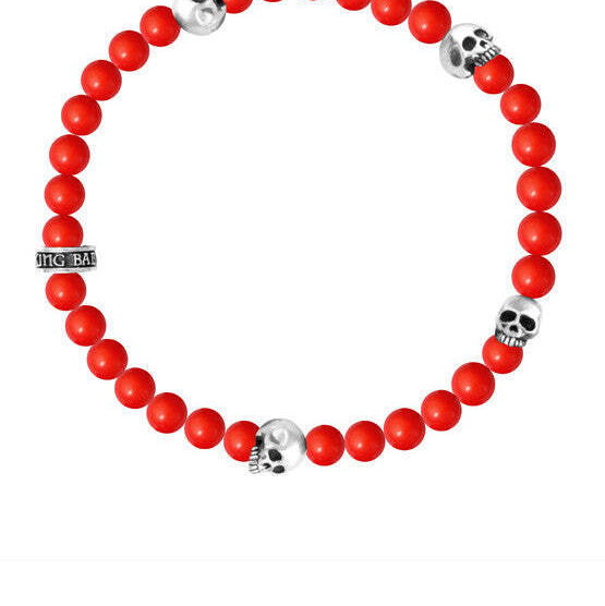 Closeup photo of 6mm Red Coral Bead Bracelet w/ 4 Skulls