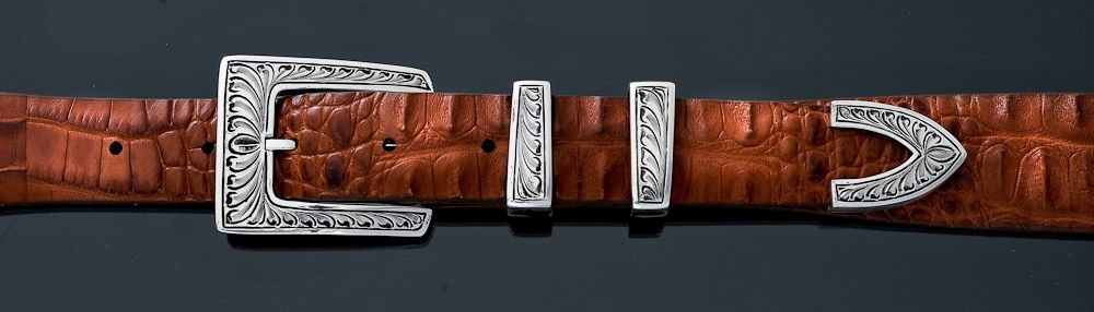 Product Number: EC56Belt Width: 1"Engraving Design: FeatherPieces in Set: FourBelt shown: Cognac Hornback Alligator Santa Fe Feather Engraved 1"