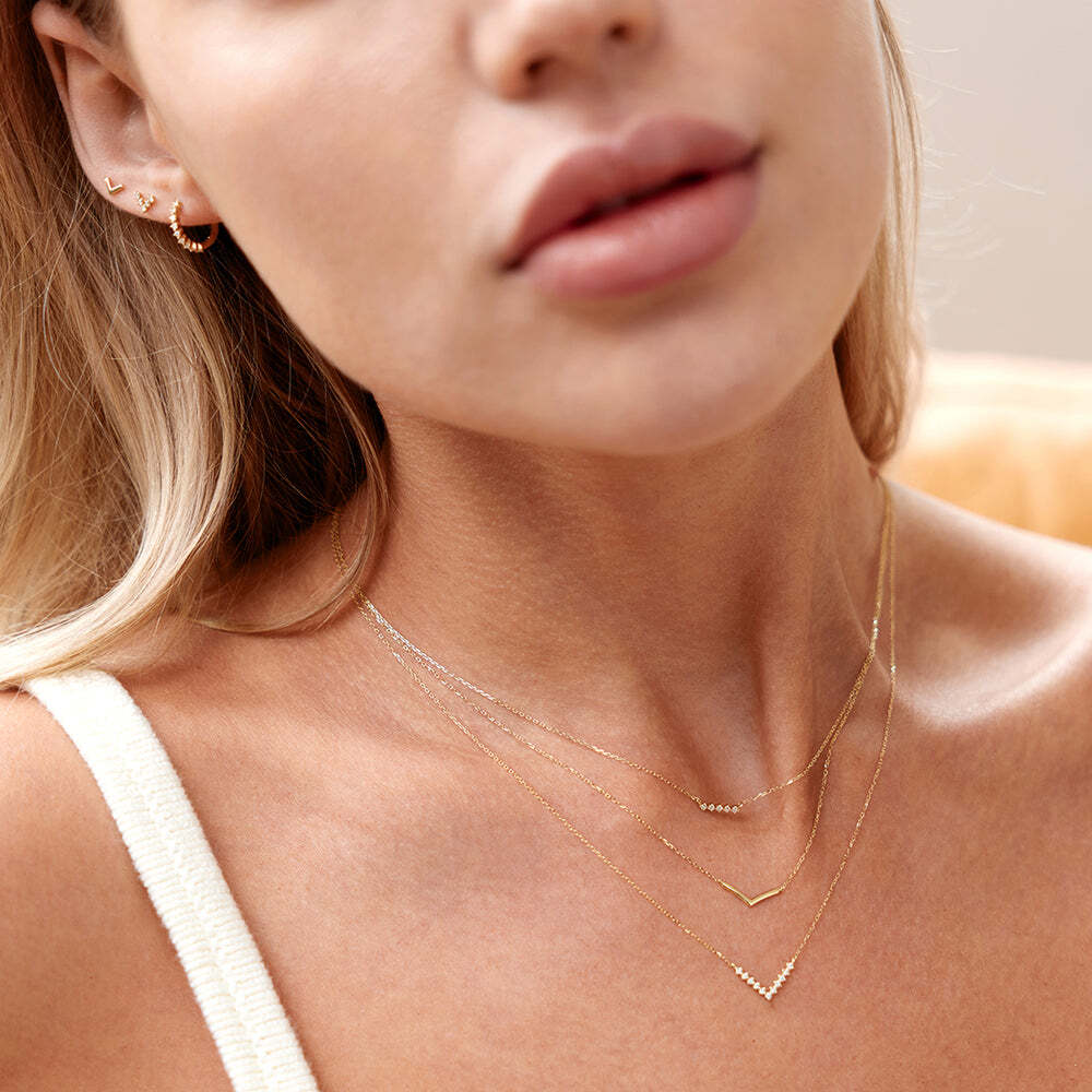 Show off your strength with this gold v-shaped wishbone necklace. Gorgeous to wear on its own yet subtle enough to pair with your favorite layering pieces and create an impact.Product Details:Material: 14K Solid Gold16" + 2" ext.Pendant Size: 4.4*12mmChain Type: Cable Chain 0.7mm thickness LAUREL | Gold Wishbone Necklace