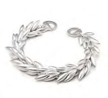 Wheat berries independently created and attached garnish this link bracelet. Striking movement and repeated forms make for dramatic handiwork. Sandblasted sterling silver, 1/2” w and 7” long. Wheat Sandblasted Sterling Silver Bracelet