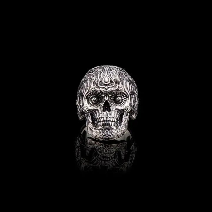 After many requests over the years, William Henry is proud to offer our signature ‘sugar skull’ in a rugged collection of beautiful rings. The Calavera is a big and bold design, unapologetic at a distance and remarkably refined up close. Exquisitely sculpted in sterling silver, with our hallmark patina finish on the outside and a flawless mirror finished inside for a great fit, this ring wears comfortably and elevates your style. Calavera is a word imbued with meanings from Dia De Los Muertos (the day of the dead), the genesis of the sugar skull style. Calavera Skull Ring