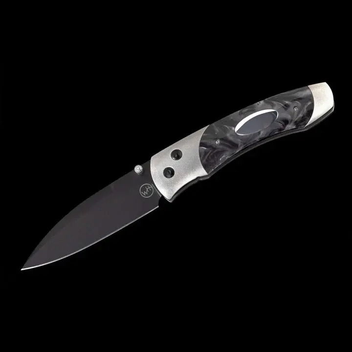 Titanium pocketknife with compressed black acrylic resin and stainless blade