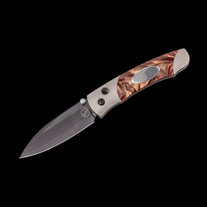 Titanium pocketknife with compressed brown acrylic resin and stainless blade