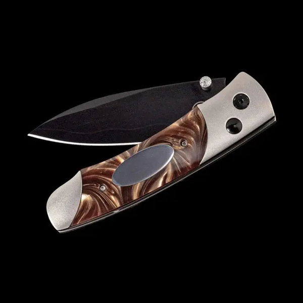 Closeup photo of Titanium pocketknife with compressed brown acrylic resin and stainless blade