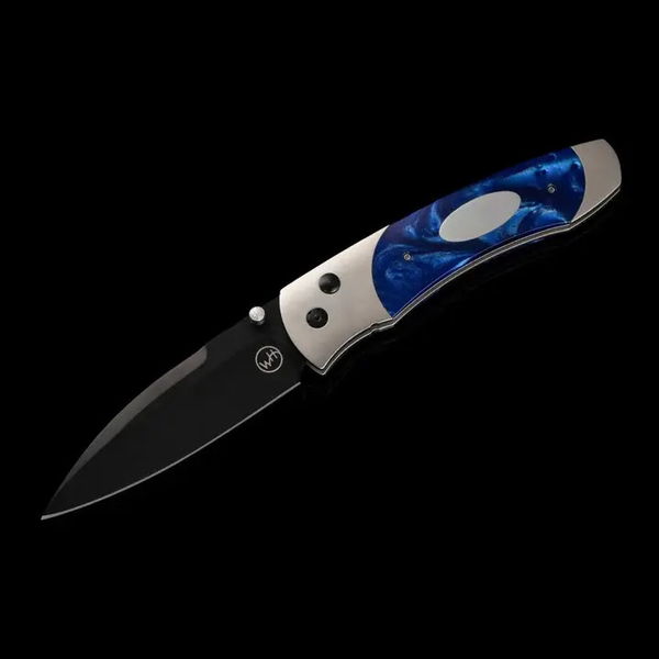 Closeup photo of Titanium pocketknife with compressed blue acrylic resin and stainless blade