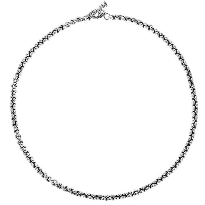 The Infinity Link Necklace is born out of two hand-carved links cast in King Baby’s proprietary .925 sterling silver. The two links are then hand assembled and interlocked together - this begins the transformation from individual part to a pattern of a united whole. Their cohesive connection creates a smooth flowing motion that is boundless with unity. This necklace comes to life during a time when the energy of strength, renewal, and connectedness is something we value most. .925 Sterling Silver Signature King Baby Loop & Toggle Closure Individual Link Width: 6.6 mm Available in 18" & 24" length Handmade in USA Infinity Link Necklace