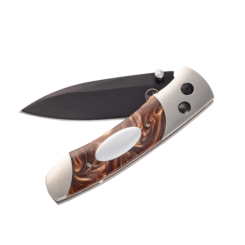 The A200-3B features a frame in hand-finished aerospace grade titanium, and inlays of compressed acrylic resin with an inset engraving plate. The blade is crafted from a three layer billet featuring a core of 10Cr15Mov, a rugged stainless steel honed to a razor’s edge. Final touches include black DLC (diamond like coating) on the blade and select fittings, and a pocket clip that allows safe ‘tip-down’ carry.Dimensions: Blade 2.63” Handle 3.25” Overall open 5.88” Titanium pocketknife with compressed brown acrylic resin and stainless blade