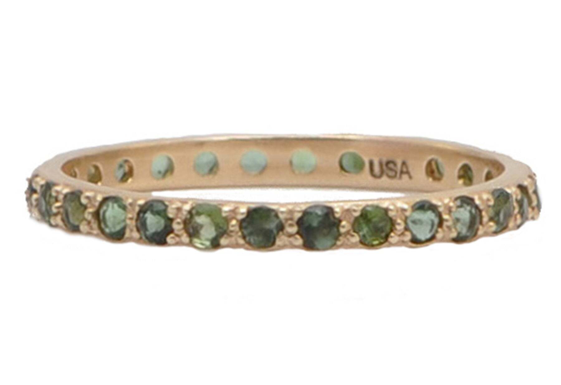 Bring some color and sparkle to your stack with this gorgeous 14K Rose Gold Stack Band Ring with Round Blue-Green Tourmaline. This ring features a simple, thin band crafted from beautiful 14K rose gold, with a stunning round blue-green tourmaline set into the center. The light, refreshing hue of the tourmaline is enhanced beautifully by the warm, flattering rose gold of the ring, and the polished finish adds a luxurious shine. Perfect for stacking with other rings or wearing alone, this beautiful ring will add a touch of elegance and sparkle to any outfit or occasion. Stack Band Ring