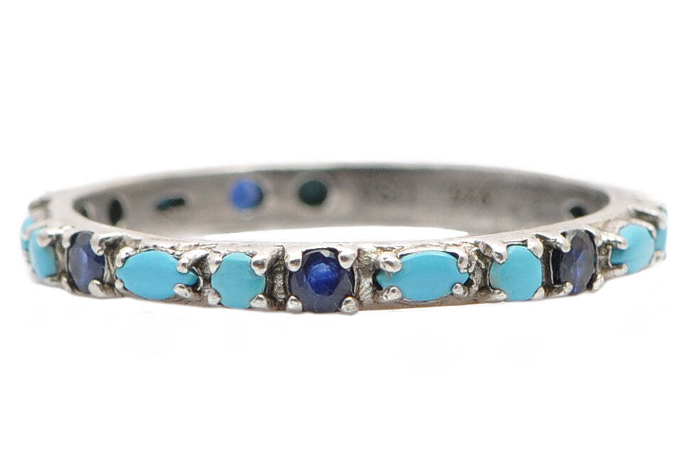 This statement-making ring set will be sure to turn heads. The sterling silver stack band ring set features marquise and round Sleeping Beauty Turquoise and round blue sapphires. The unique combination of stones and elegant grey sterling silver provide the perfect balance of classic and modern. Whether you’re looking for a special gift or a stunning piece to add to your own collection, this ring set won’t disappoint. Stack Band Ring