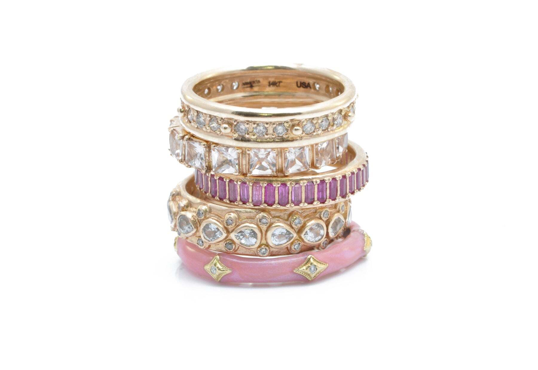 This stunning 14K rose gold channel set pink sapphire baguette stack band ring will add a hint of sparkle to your look. A channel-set band of pave-set pink sapphire baguettes is stacked onto a thin, high polished rose gold ring. This elegant and timeless design will brighten up any outfit, from casual to formal, and will be a lasting reminder of your beauty. A perfect gift for your loved one, or an addition to your own jewelry wardrobe. Baguette Stack Band Ring