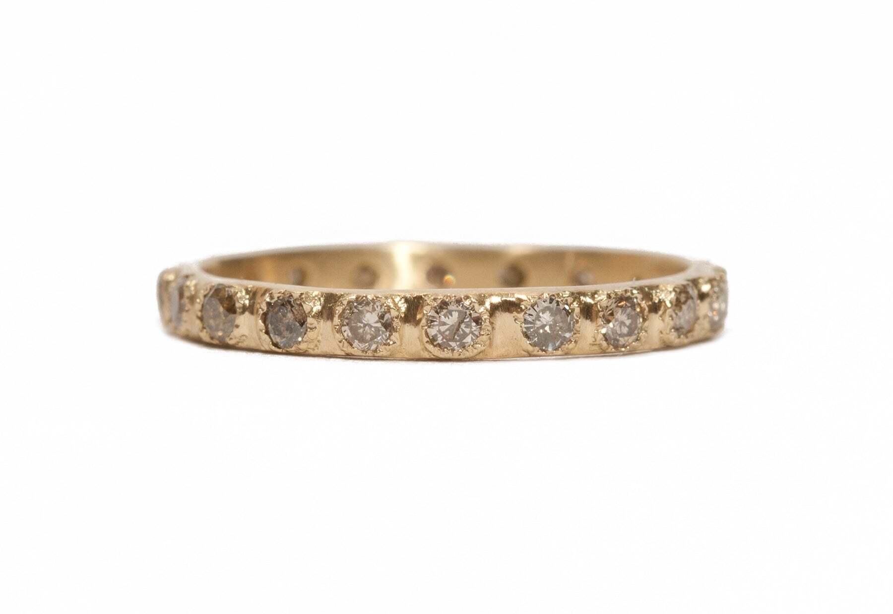 Gorgeous and classic, this stack ring is truly timeless with its 0.50 TCW of round cut champagne diamonds set in a beautiful 18K yellow gold band. The delicate and feminine design sparkles from every angle, sure to make any occasion special. Perfect for wearing alone or paired with other rings for a stackable look, this ring is the ultimate classic luxury for any jewelry wardrobe. Diamond Stack Band Ring