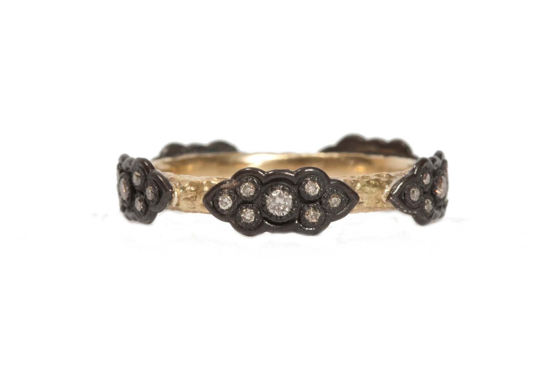 This stunning 18K Yellow Gold and Blackened Sterling Silver Pave Scroll Station Band with White Diamonds (0.29 TCW) is the perfect choice to add some sparkle to your look. With its delicate pave scroll design, this band is sure to be noticed and admired. The glamorous white diamonds (0.29 TCW) are set in a blackened sterling silver setting, creating a luxe contrast against the yellow gold band. This beautiful band is sure to make an elegant statement. Pave Scroll Station Stack Band Ring
