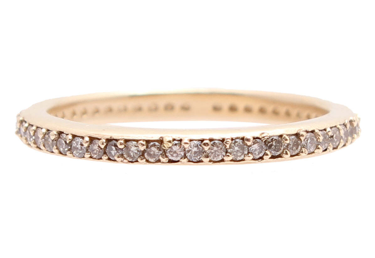 This eye-catching 14K rose gold stack band sparkles with champagne diamonds, giving the ring a classic yet modern look. The beautful ring is delicately constructed with 0.62 total carat weight, adding effortless elegance for any occasion. Perfect for stacking and layering, the rose gold is sure to stand out and make a stunning statement. Diamond Stack Band Ring