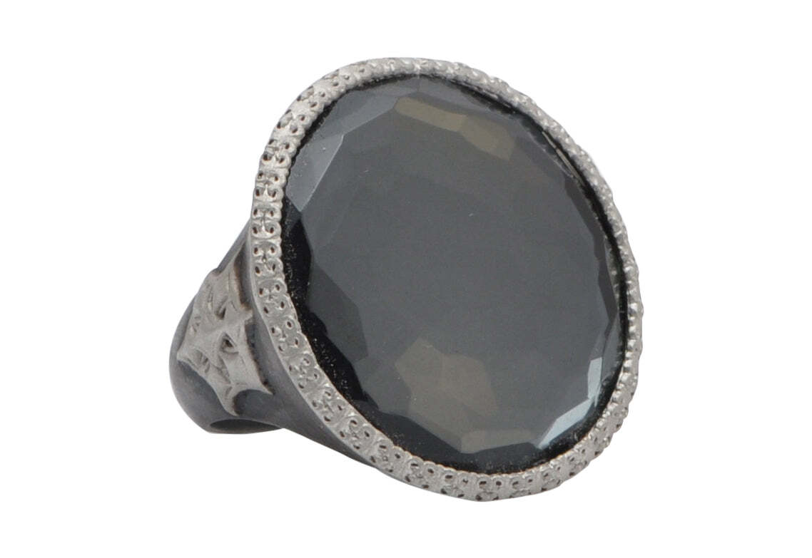 This stunning sterling silver ring boasts a 25mm natural round hematite and white quartz combination. The eye-catching design is completed with an intricate Crivelli starburst pattern, making it the perfect accessory for any special occasion. The unique combination of stones and intricate design create a unique and contemporary look that will be admired by all. This beautiful ring is sure to become a treasured piece in any collection. Large Round Statement Ring