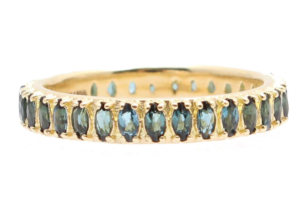 This stunning 18k yellow gold stack band is the perfect accessory to add a touch of elegance to any look. This timeless piece features a marquise shaped blue-green tourmaline that is sure to turn heads. The beautiful tourmaline is showcased atop a smooth gold band and comfort fit finish for a comfortable, secure fit. Whether you are searching for a unique anniversary or birthday gift, or something to treat yourself, this gorgeous band is a must-have. Marquise Stone Stack Band