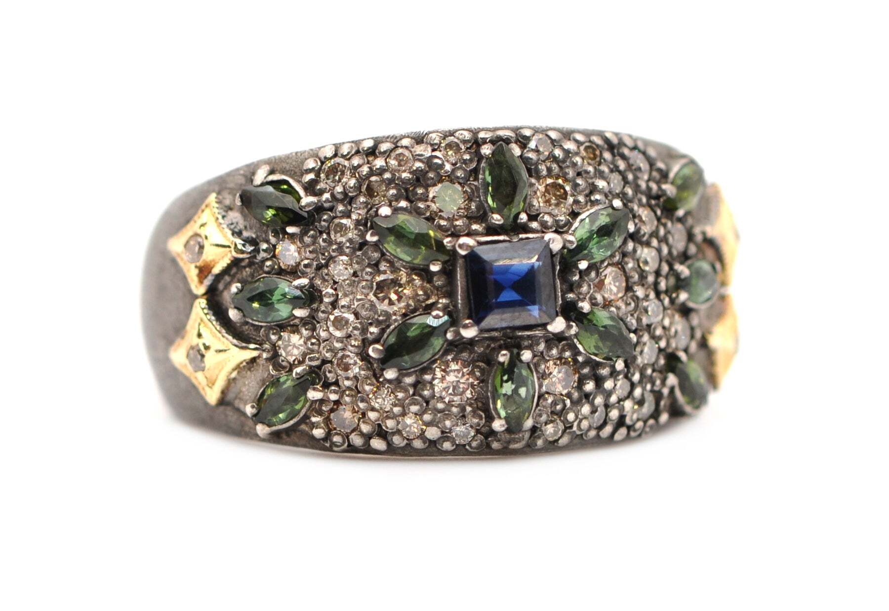 This stunning 18k yellow gold and grey rhodium finish sterling silver pave signet ring is adorned with Crivellis and blue sapphires, blue-green tourmalines and .35TCW round champagne diamonds. The combination of luxurious gold and cool rhodium silver brings an elegant touch to this piece of jewelry, perfect for any special occasion. The ring face measures 11.9mm and is perfect for making an unforgettable statement. Add this beautiful piece to your jewelry box today and brighten up any outfit with a classic and stylish look. DIAMOND PAVE MULTI GEMSTONE STAR SIGNET RING