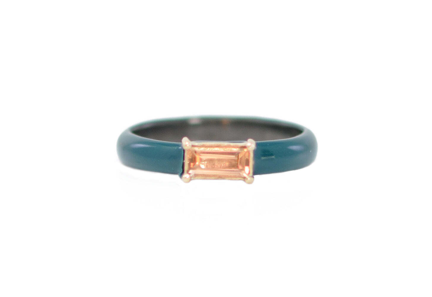 This elegant teal enamel ring is crafted from 14k rose gold and blackened sterling silver, featuring a stunning peach imperial topaz east west baguette. Flaunting a delicate balance between contemporary design and classic appeal, this eye-catching piece will bring timeless glamour to any look. Add this timeless beauty to your wardrobe for a luxurious upgrade that you'll be sure to treasure for years to come. Enamel with Topaz Station Stack Ring