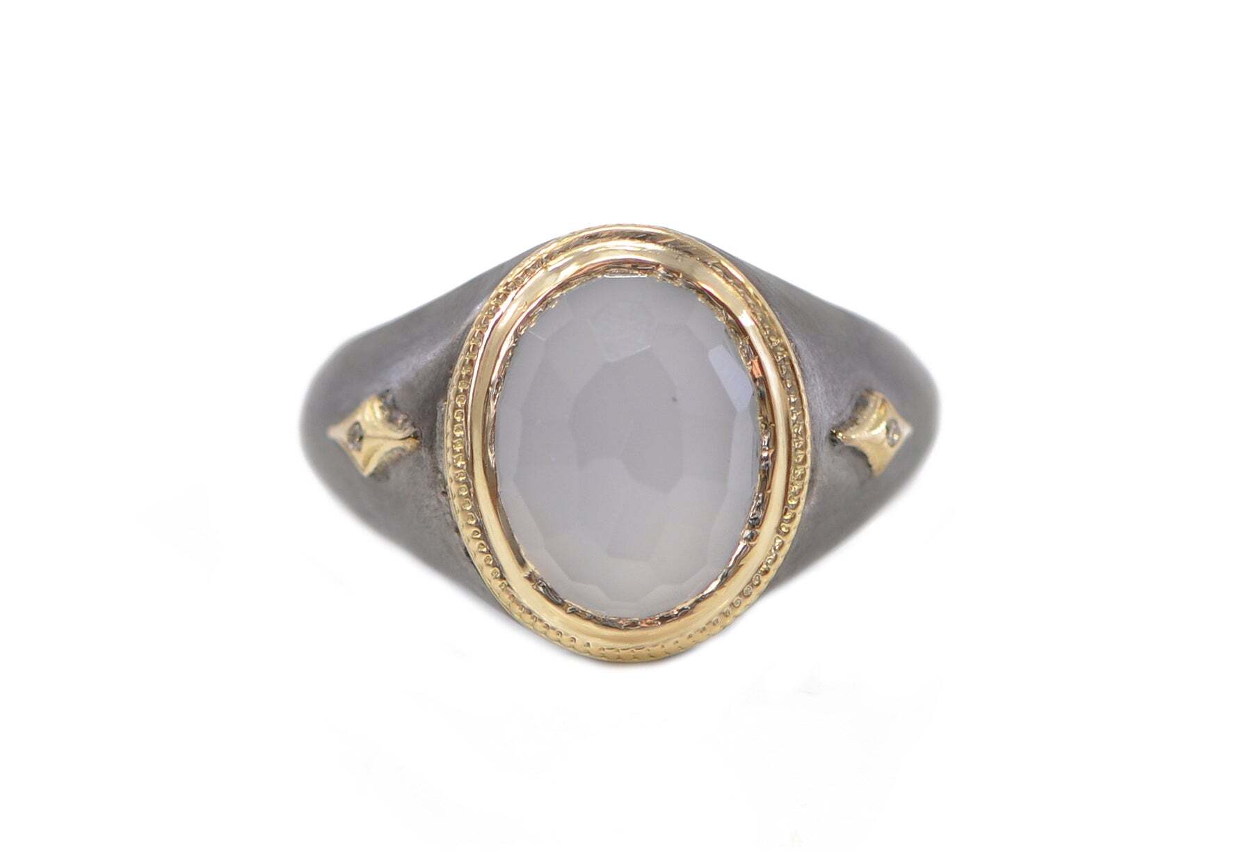 This high-end, luxurious mens ring is crafted from 18k yellow gold, with a unique blackening treatment and high-quality 0.01 carat champagne diamonds. The centerpiece of this stunning piece is the 14x11 oval Turkish Chalcedony, adding a touch of elegance and sophistication. This ring is the perfect way to demonstrate your fashion-forward style and exceptional taste. TURKISH CHALCEDONY SIGNET RING