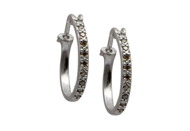 Looking for the perfect accessory to add a touch of sparkle to your outfit? Look no further than these gorgeous sterling silver 16mm hoop earrings with champagne diamonds. Crafted from sterling silver, these earrings feature a secure closure and dazzling champagne diamonds weighing 0.08 TCW. Whether you’re dressing for a night out or just looking for a subtle way to accessorize your everyday look, these dazzling earrings are sure to be the perfect fit. Champagne Diamond Huggie Hoop Earrings