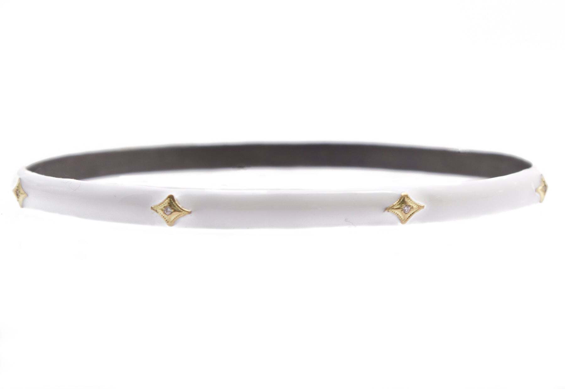 This beautiful 18K Yellow Gold and Sterling Silver Crivelli Bangle Bracelet is adorned with white enamel and the shimmering shine of white diamonds. The delicate piece of jewelry has a total of 0.03 carats of diamonds (TCW) that will add a luxurious touch to any look. This bracelet is a timeless piece of jewelry that looks great with everyday wear and can be dressed up for special occasions. Perfect for any gift-giving occasion, this bangle bracelet will bring a smile to any lucky recipient. Crivelli White Enamel Bangle Bracelet