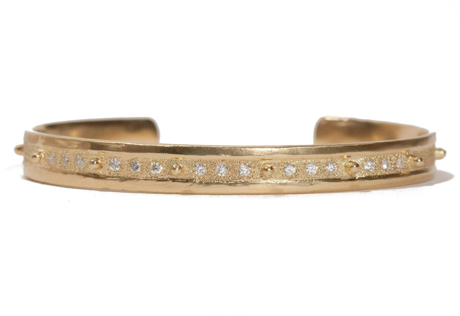 This classic bracelet is perfect for the chic and sophisticated woman. Crafted in 18K yellow gold, this timeless cuff features a row of beautiful white diamonds (0.31 TCW) that sparkle from every angle. Perfect for any occasion, this bracelet is a classic addition to any jewelry collection. Diamond Cuff Bracelet