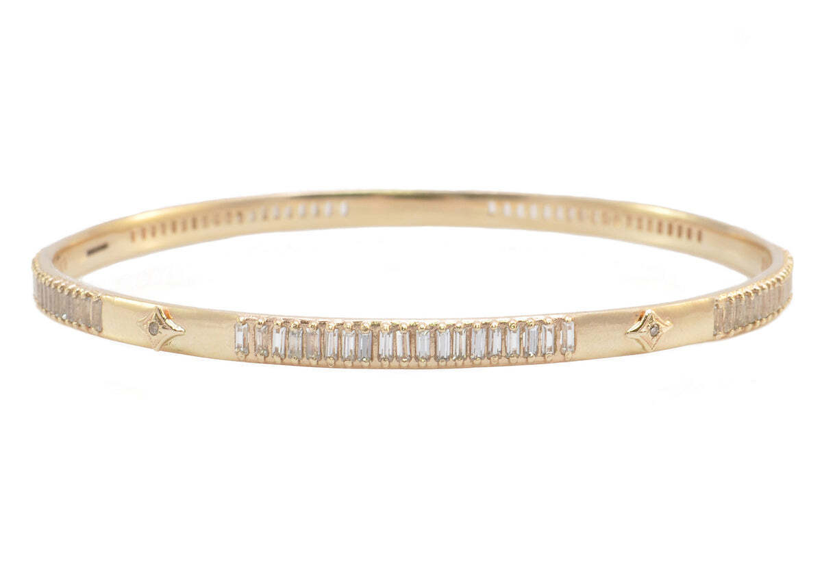 This elegant and eye-catching bangle bracelet is crafted from 14k Rose Gold and adorned with champagne diamonds, white sapphire baguettes and delicate crivelli. It is the perfect piece for adding sparkle to your look and will make you look stunning. The versatile design makes this bracelet suitable for nearly any occasion, from special events to everyday wear. The champagne diamonds and white sapphire baguettes give this piece a hint of sparkle while the crivelli add a touch of glamour. Indulge in luxury and let this beautiful piece of jewelry put the finishing touches on your look. ROSE GOLD BANGLE BRACELET
