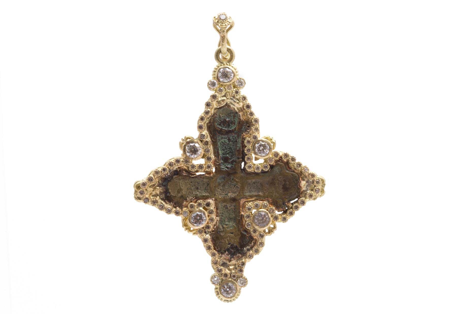 This 18K Yellow Gold Large Curved Artifact Cross Pendant is an exquisite statement piece. Encased with a stunning array of white and champagne diamonds that dazzle beautifully with every movement, this pendant has a total diamond weight of 1.30 TCW. The elegant center of diamond-encrusted gold is framed by a spilt-shank bale – perfectly balancing the classic shape of this pendant. An exceptional heirloom quality piece to make your own. Artifact Cross Pendant