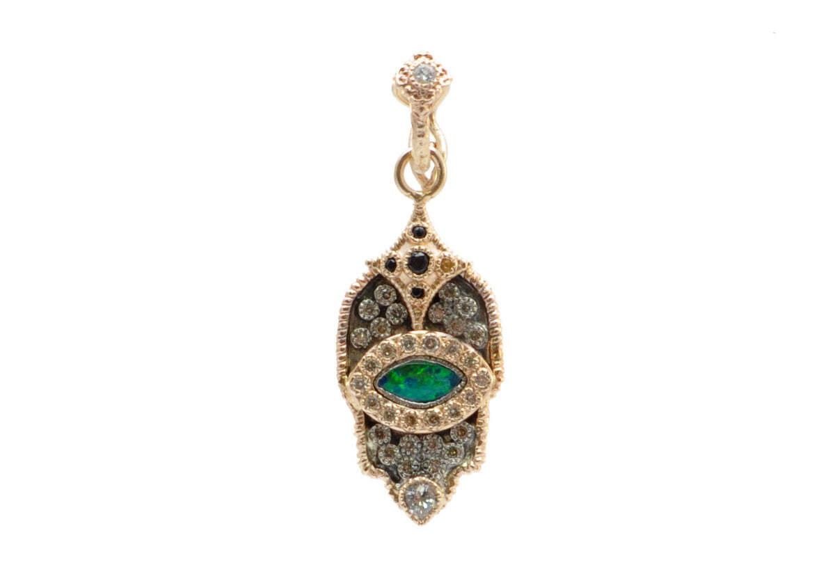 This exquisite 14K Rose Gold and Sterling Silver Pave Hamsa Opal Eye Pendant with Champagne Diamonds is sure to make a statement. The sparkling 0.21 TCW champagne diamonds are set in an eye-catching pave gesture, while the hamsa is adorned with a beautiful opal in the center to complete the look. With its stunning design and luxurious materials, this pendant will become your go-to piece for any occasion. Pave Eye Pendant