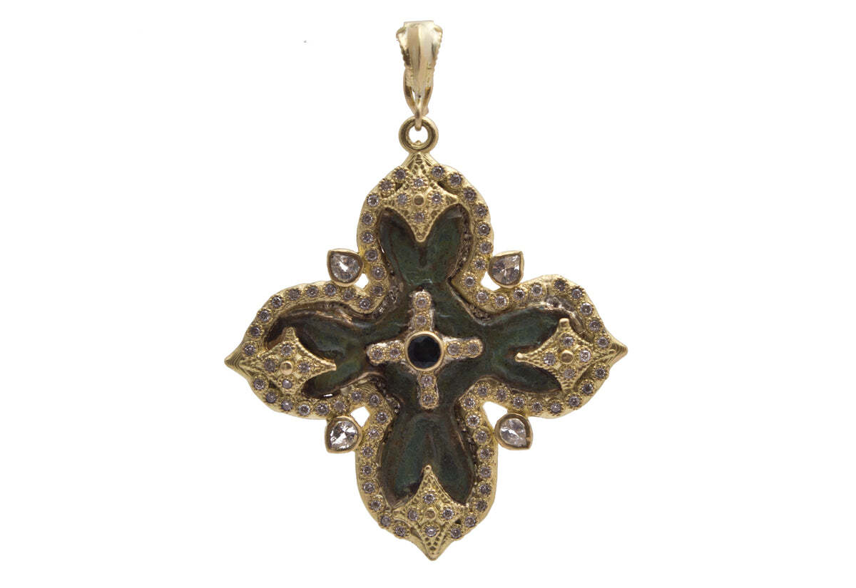 This breathtaking 18K yellow gold 24mm wide cross pendant is truly an indulgent artifact for your collection. Its magnificent display of tourmaline, white diamonds and white sapphires (0.46 TCW) is sure to add a touch of classic and timeless elegance to your wardrobe. Blending traditional design with modern flair, this statement-making piece is sure to be a statement-piece for years to come. An exquisite pendant that is sure to be cherished for its exquisite craftsmanship and exquisite beauty. Cross Artifact Pendant