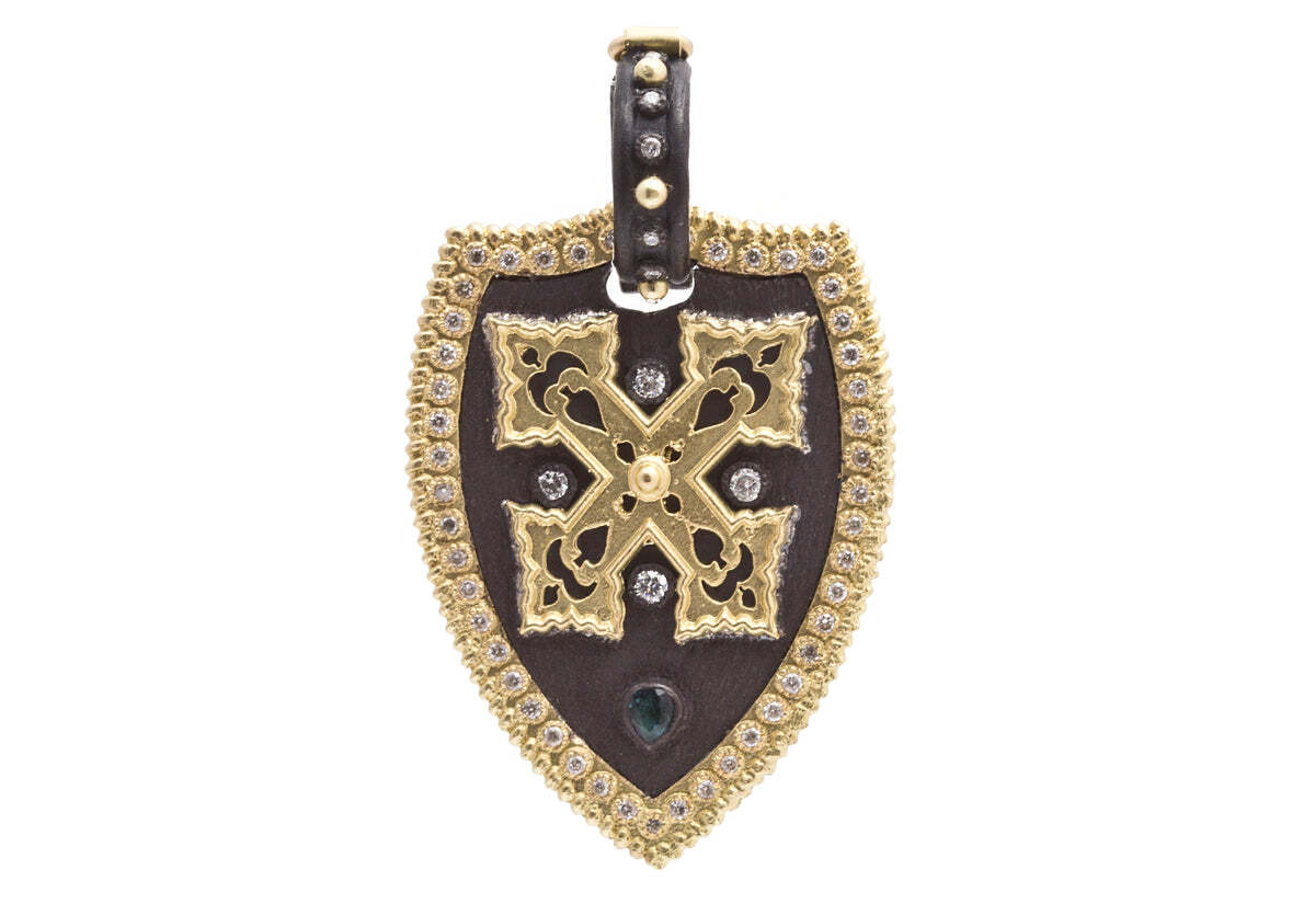 This stunning 18K yellow gold and blackened sterling silver cross shield pendant with green tourmaline and white diamonds (0.34 TCW) is the perfect piece of jewelry for any special occasion. The cross design symbolizes faith and protection, while the green tourmaline and 0.34 TCW of white diamonds give the piece a touch of sparkle and shine. This timeless pendant will add elegance, sophistication and style to any outfit. With its classic and timeless design, this pendant is the perfect accessory to show off your faith and style. Cross Shield Pendant