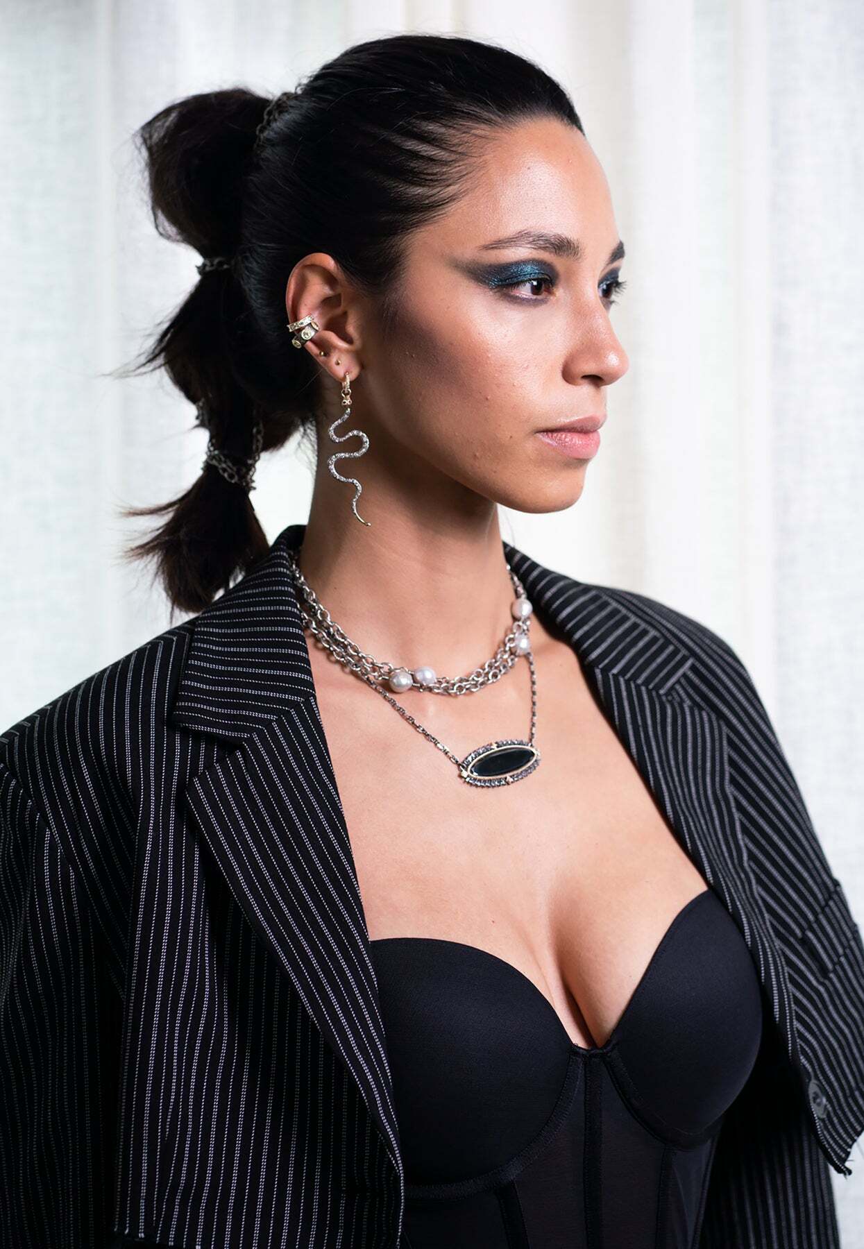 This stunning 14k Rose Gold and Gunmetal Sterling Silver serpent enhancer is the perfect addition to your necklace collection. Its pave champagne diamond accents create an eye-catching look and its red garnet eyes add a spark of elegance. Its sleek design will make any ensemble look fashionable and chic. It's the perfect accessory for any special occasion or everyday wear. Show off your unique style with this gorgeous enhancer. Serpent Enhancer