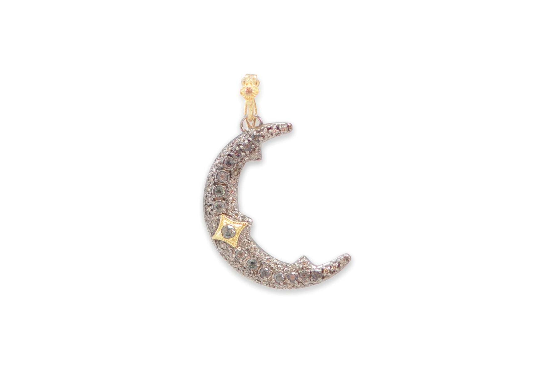 Elevate your look to the heavens with this exquisite crescent moon charm. Crafted from 18 karat yellow gold and blackened sterling silver, this 35mm charm features a pave setting of stunning Crivelli Blue Grey Sapphires and Champagne Diamonds. This celestial charm will add a touch of sparkle and magic to any look. Pave Crescent Moon Enhancer