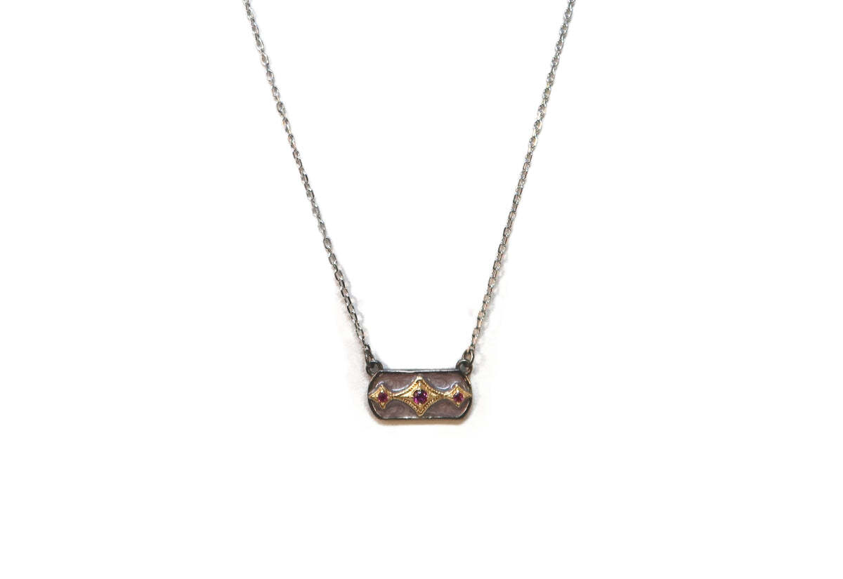 This exquisite Crivelli Bar 14k Rose Gold and Grey Sterling Silver Necklace with Mystic Moon Enamel and Purple Garnet will add an elegant touch to your wardrobe. Delicately crafted with a unique enamel design, this necklace has a moon shape adorned with a deep purple garnet at its center. The adjustable chain is also sterling silver and adds a stylish element. Whether you’re looking for a special present or just a stylish accessory for yourself, this necklace is the perfect addition to any outfit. The adjustable chain can be adjusted from 15.5"- 16.5" for a perfect fit. 16.5" MYSTIC MOON ENAMEL CRIVELLI BAR NECKLACE