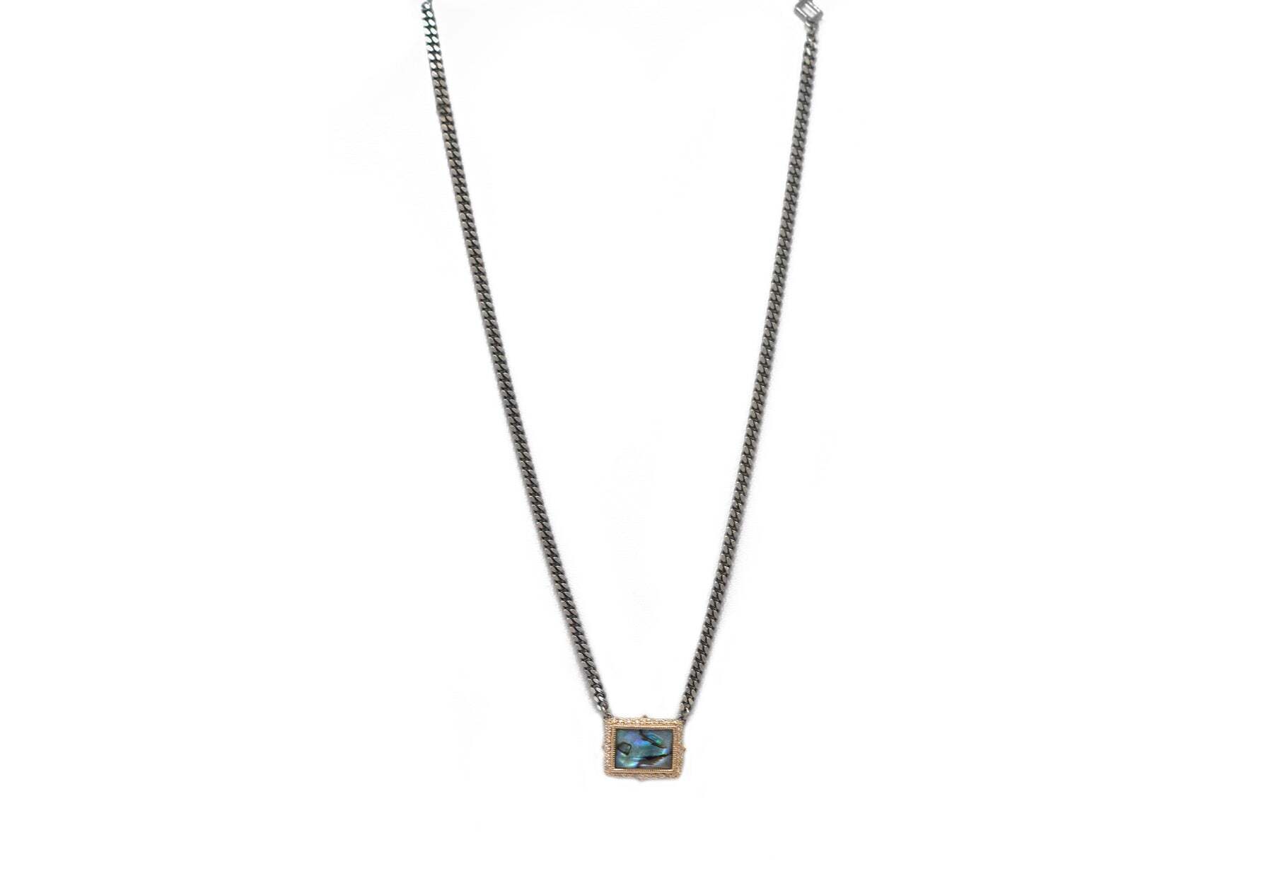 This exquisite necklace is crafted from luxe 14k rose gold and sterling silver for a bold and beautiful look. The 0.15 CT white diamonds glimmer against the 13x9mm mother of pearl for a truly show-stopping sparkle. The adjustable 16"-18" chain allows you to customize your look easily. Whether you're dressing up for a night out or a special occasion, this exquisite necklace is sure to be the perfect statement maker. 18" BLUE MOTHER OF PEARL NECKLACE