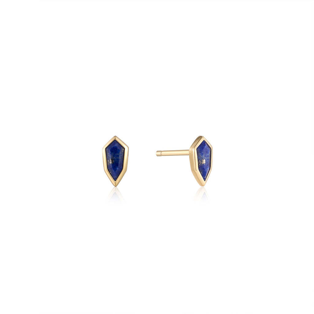 Opt for bold style and a flash of vibrant colour this season with these breath-taking lapis stone stud earrings. Cut into a unique emblem-inspired shape, these lapis earrings elevate a simple look, adding a classic but edgy accessory to your style. Wear them solo or stack yours with a pair of smooth and simple huggies. • Earring Size: 5.4mm x 2.7mm x 2.2mm• Lapis Size: 5mm x 2.3mm x 1,8mm• Weight: 0.6g Gold Lapis Emblem Stud Earrings