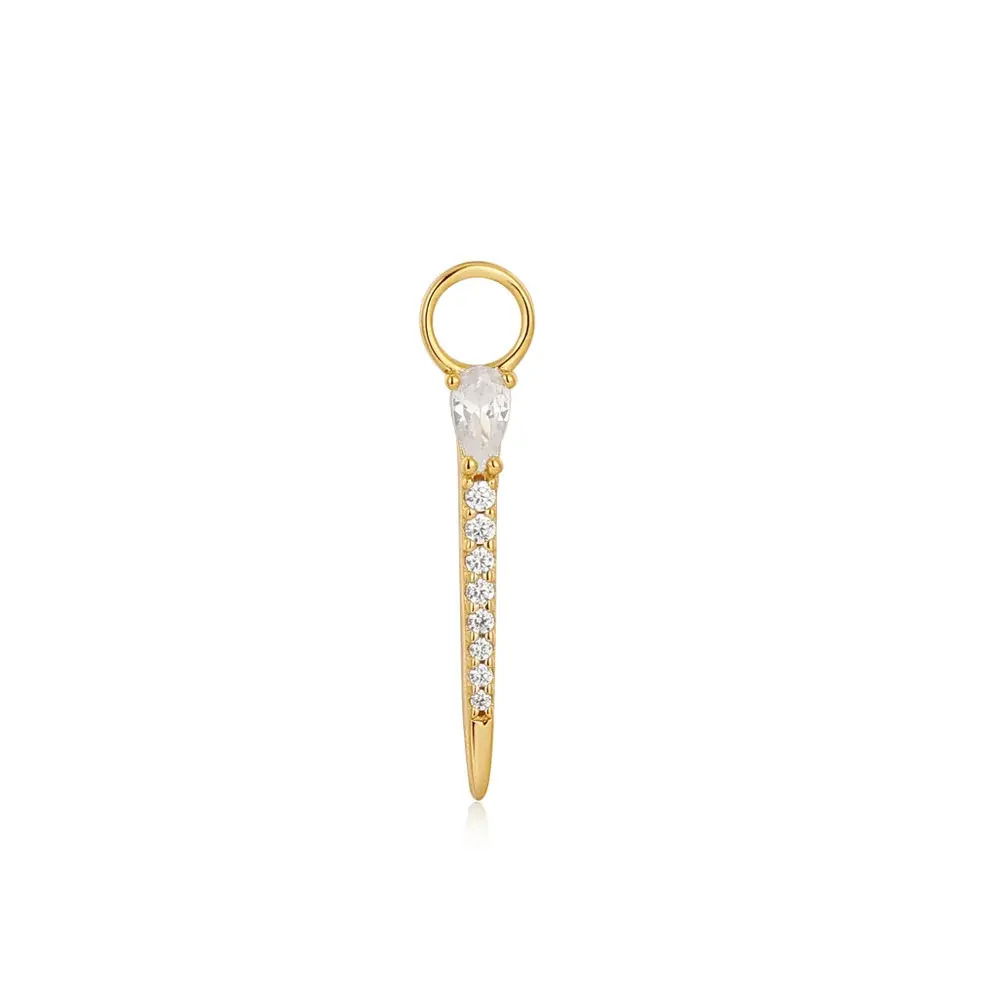 Transform your huggie or hoop earrings with a touch of sparkle with this stunning bar earring charm, crafted from 925 sterling silver with 14kt gold plating. Designed to slip straight onto your hoop earring, the charm is finished with a row of sparkling cubic zirconia stones, creating a unique twist on a classic drop earring. Gold Sparkle Bar Earring Charm