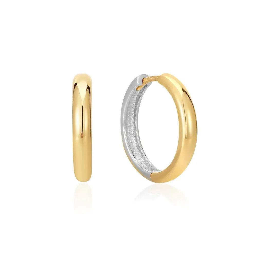 Product Description:Opt for mixed metal this season with our stunning two tone hoop earrings. Pairing gold and silver, these versatile earrings are the perfect addition to any chic earring stack. Wear yours as simple hoops or open them up and add your favourite earring charm from the Pop Charms collection to create something truly unique to you. Product Details:• Material: 925 Sterling Silver with Two Tone Plating• Earring Diameter: 18mm• Earring Width: 3.1mm• Weight: 3.2g Two Tone Hoop Earrings