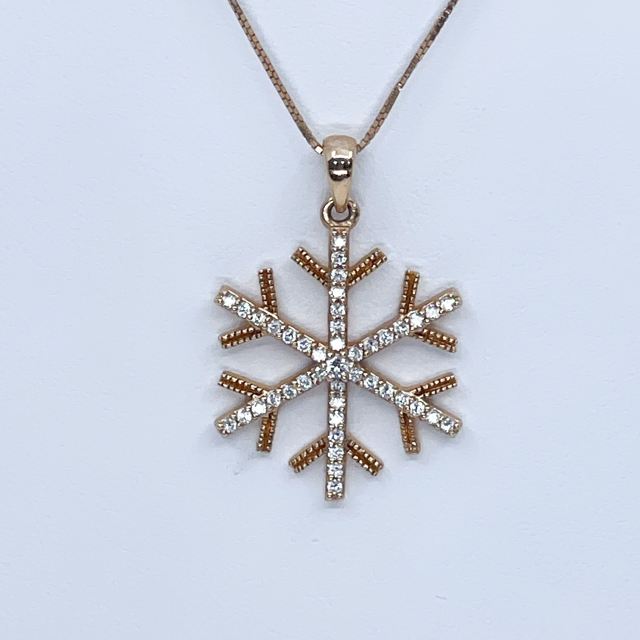 .25ct DiamondSnowflake is 3/4ths of an inch in height and widthChain Sold Separately 14kr 0.25k dia Gold Snowflake Pendant