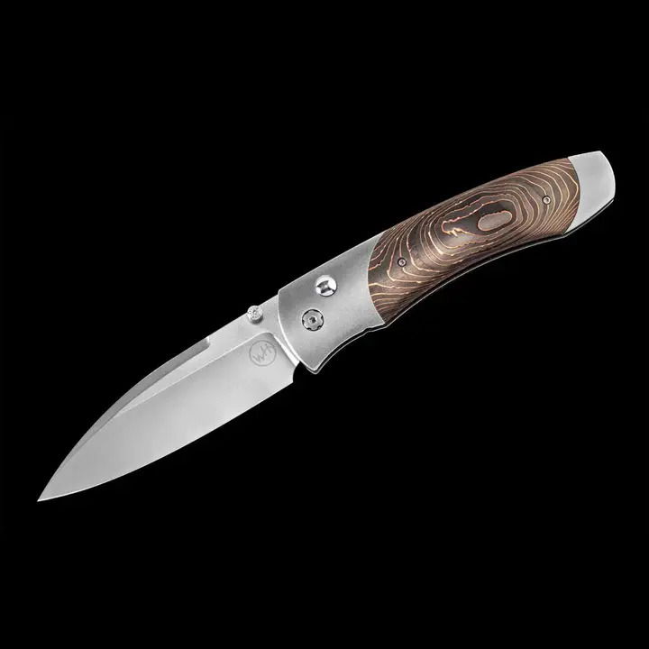 Titanium pocketknife with stainless blade and carbon fiber Titanium pocketknife with compressed Copper Swirl Carbon Fiber and stainless blade