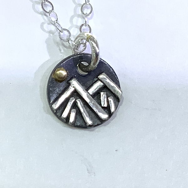 Closeup photo of Winter Mountain Oxidized Charm 22K and Sterling Silver Necklace