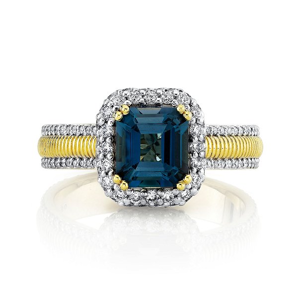 Closeup photo of LONDON BLUE TOPAZ CUSHION RING WITH WHITE DIAMOND DETAILING AND STRIE SHANK
